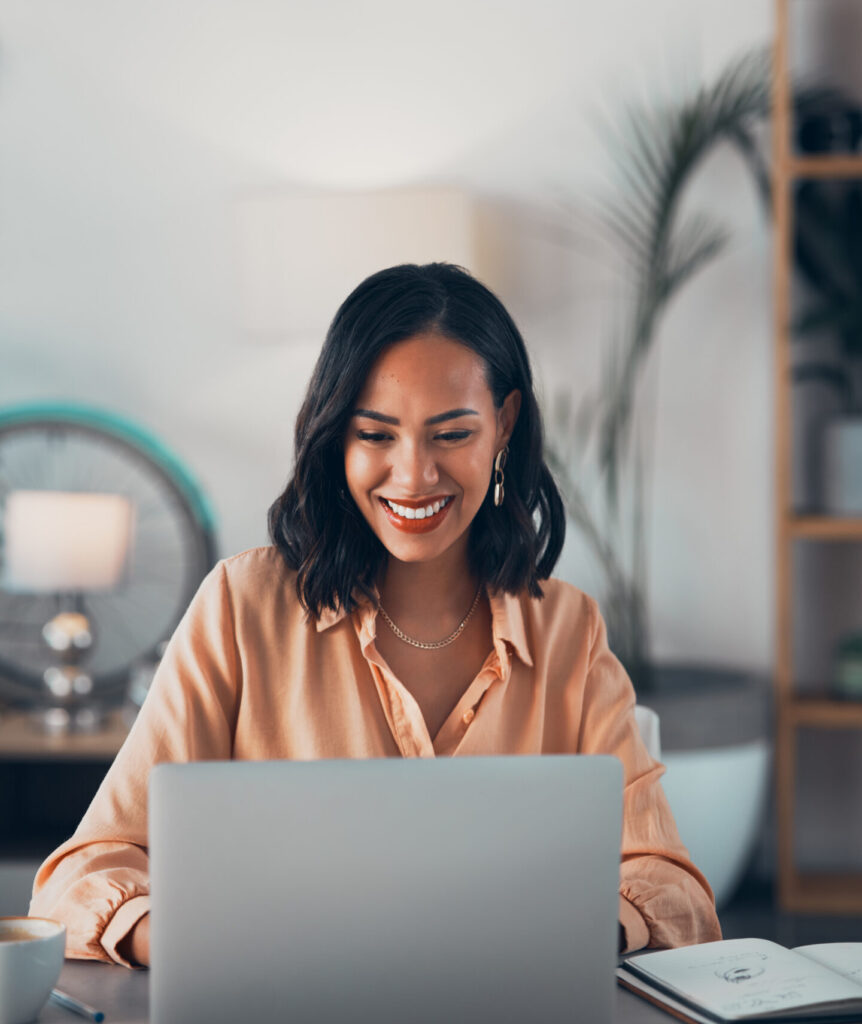 Smiling female corporate worker reading emails, making connections and searching web